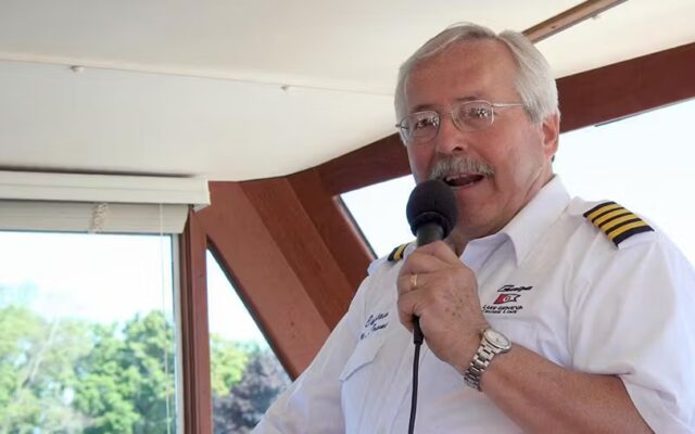 boat captain speaking into microphone